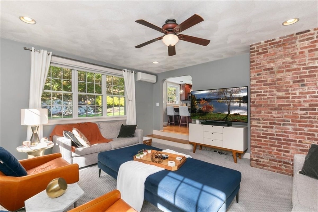 31 Robert Street Wakefield, MA 01880 - Photo 20 of 41 a living room with furniture and a flat screen tv