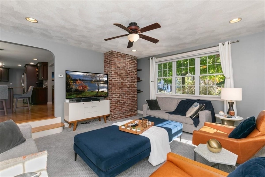 31 Robert Street Wakefield, MA 01880 - Photo 21 of 41 a living room with furniture and a flat screen tv