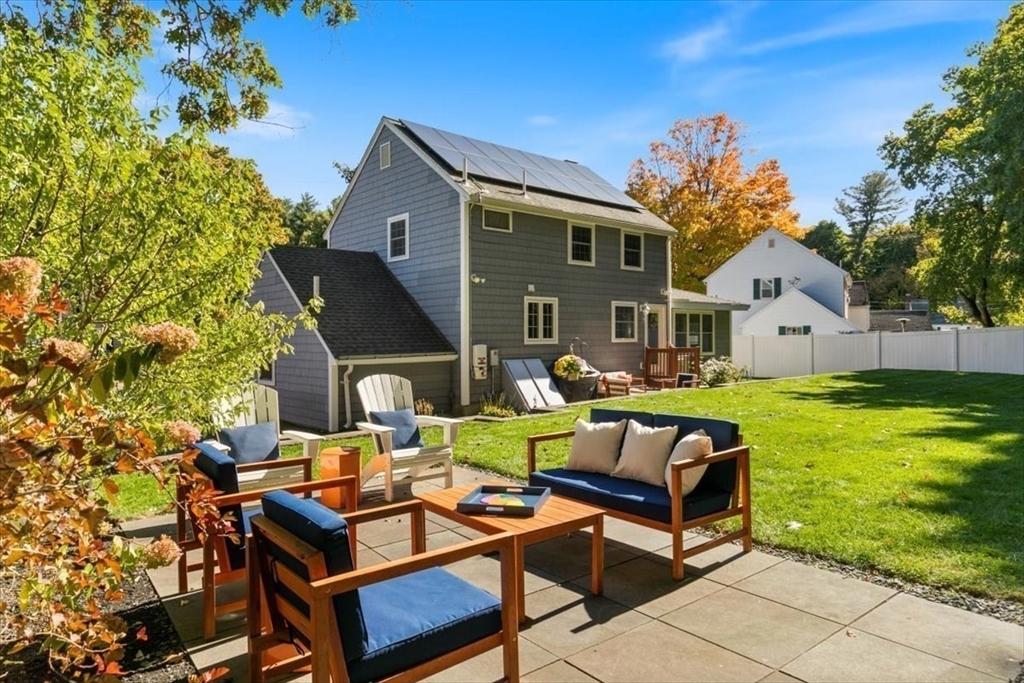 31 Robert Street Wakefield, MA 01880 - Photo 35 of 41 a front view of a house with swimming pool garden and outdoor seating