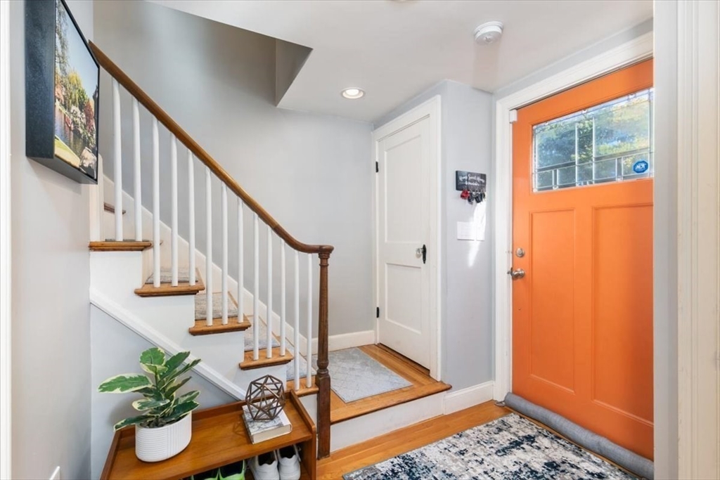 31 Robert Street Wakefield, MA 01880 - Photo 7 of 41 a view of entryway with wooden floor and stairs