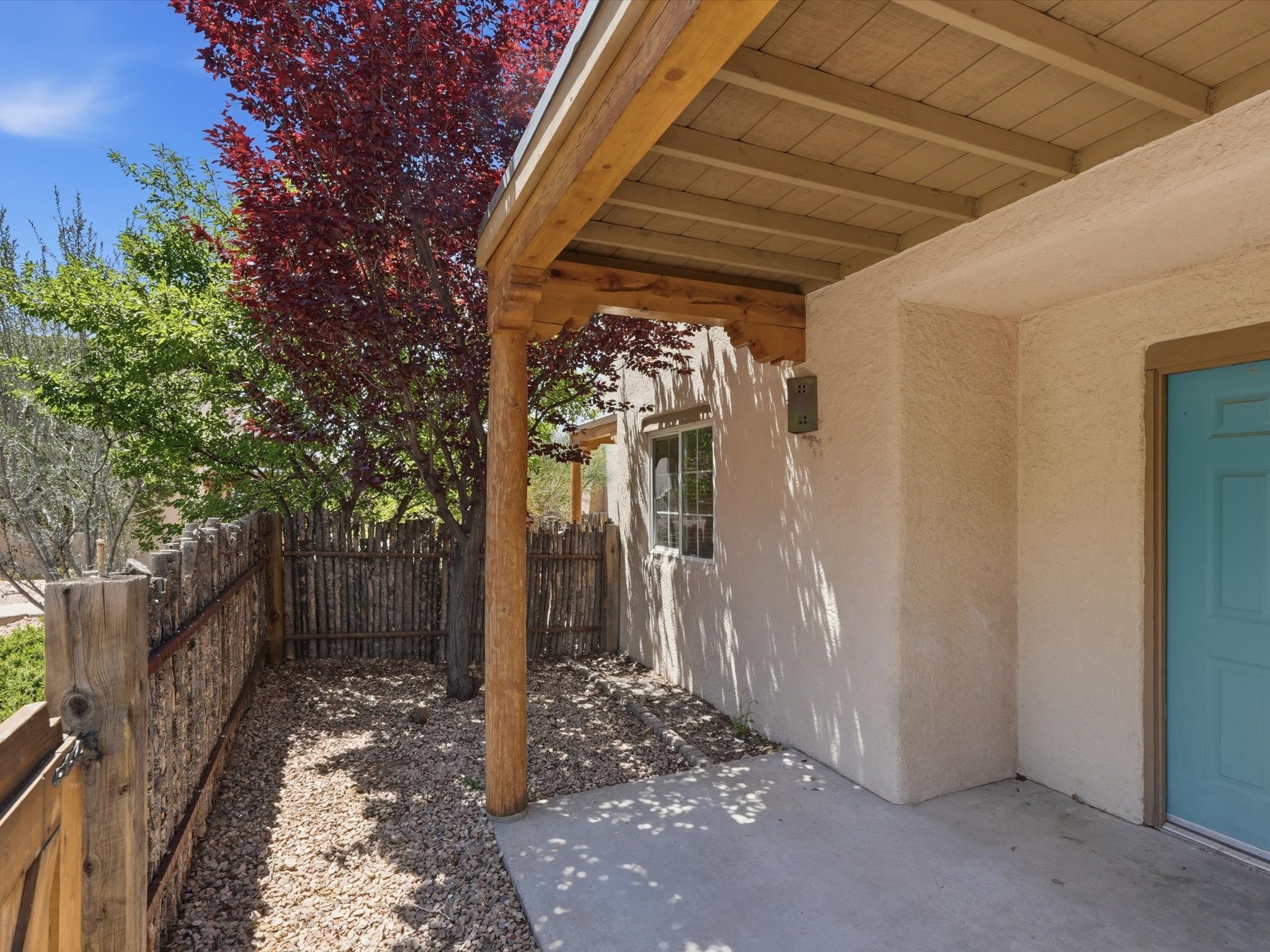 2210 Miguel Chavez Road, Unit 411 Santa Fe, NM 87505 - Photo 34 of 59 Front yard of the unit with coyote fence for privacy