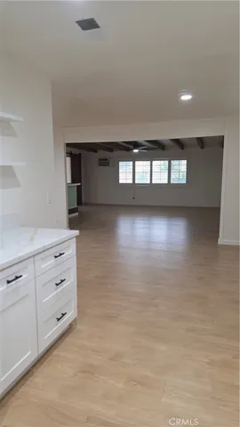 a living room with hard wood floors