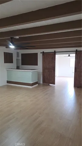 a living room with a bench and a fireplace