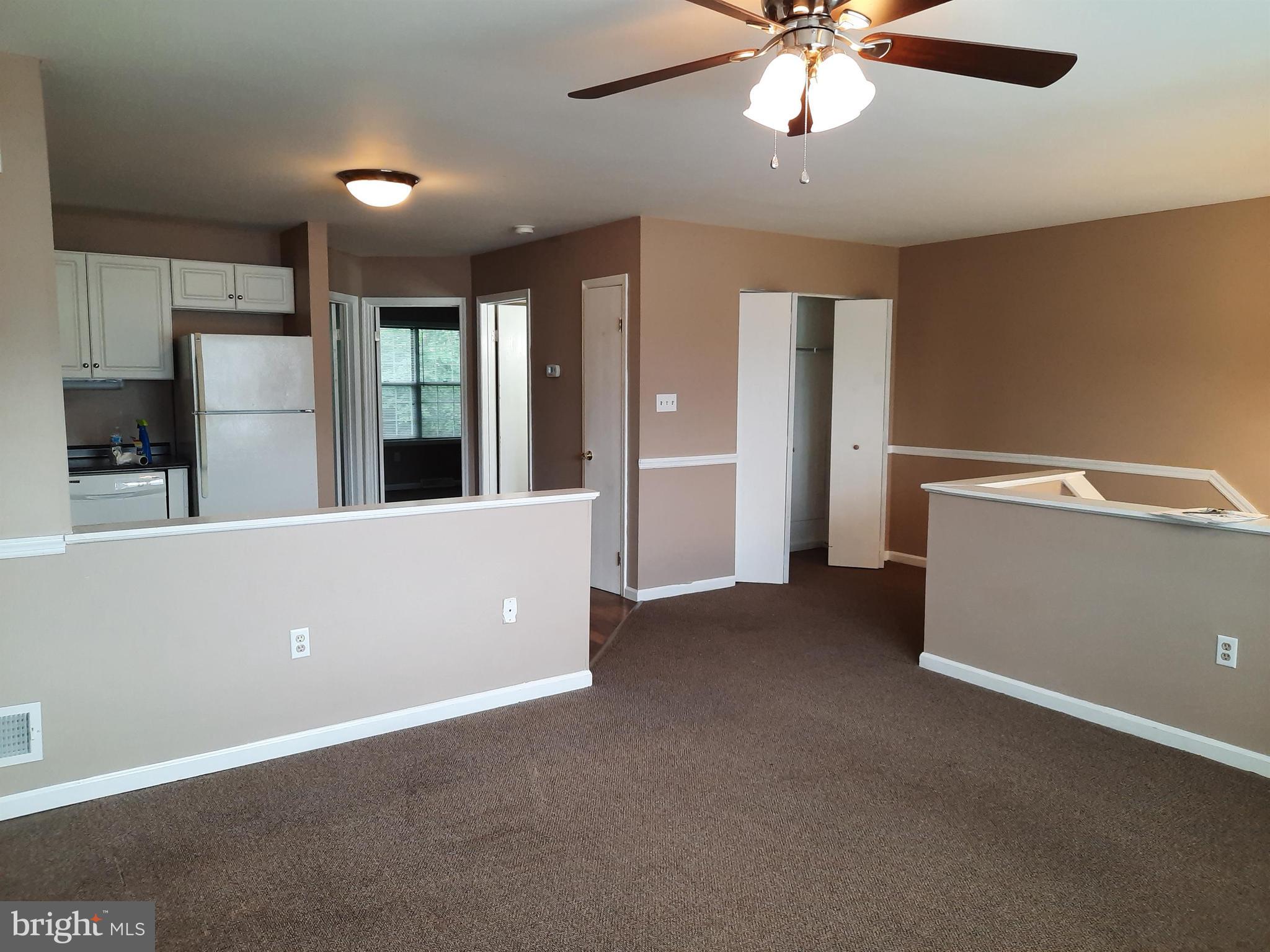 142 Pickwick Place Millersville, PA 17551 - Photo 3 of 8 a view of an empty room with window and a kitchen