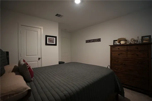 a bed room with a bed and a closet
