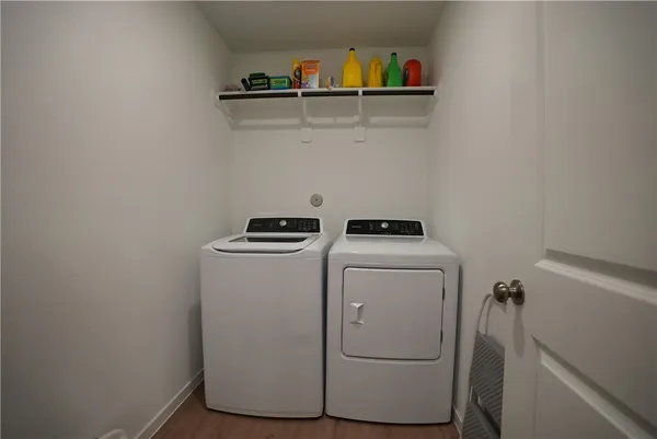 a utility room with dryer and washer