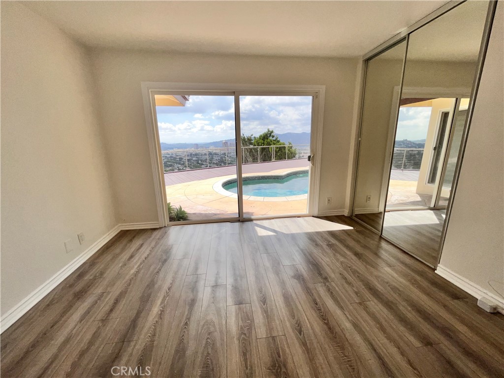 881 Harrington Road Glendale, CA 91207 - Photo 29 of 35 wooden floor in an empty room with a window