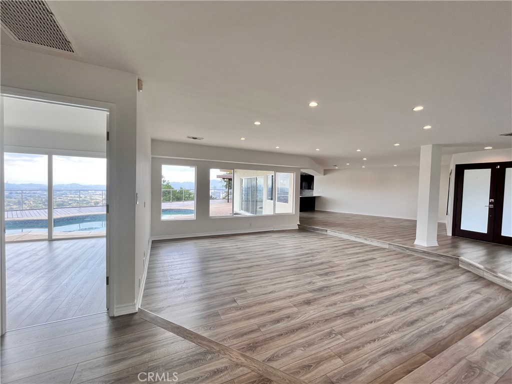 881 Harrington Road Glendale, CA 91207 - Photo 4 of 35 a view of an empty room with wooden floor and a window