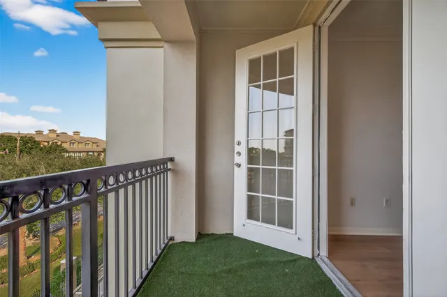a balcony with furniture and city view