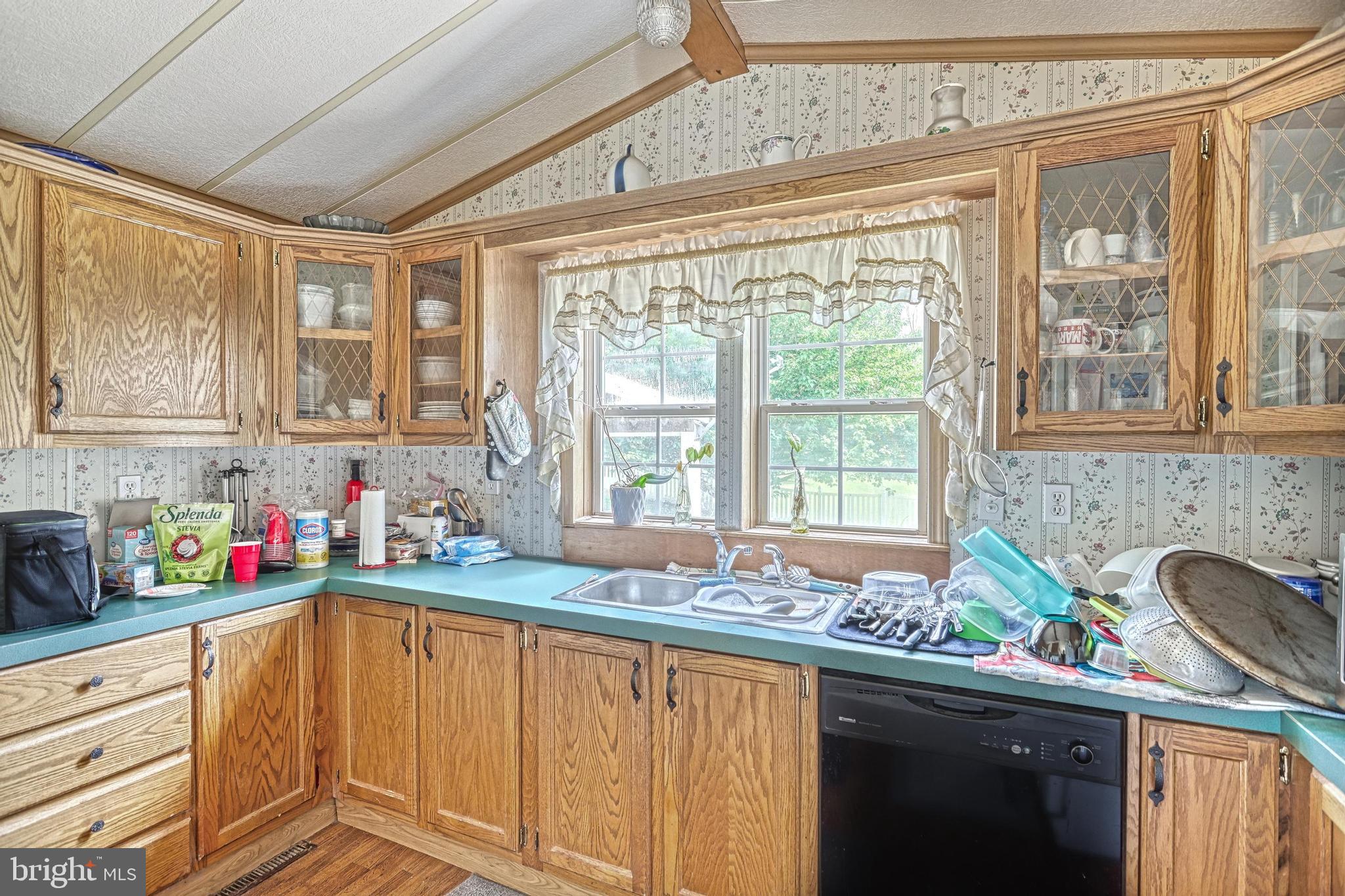 13859 Ebaugh Road Stewartstown, PA 17363 - Photo 11 of 61 a kitchen with sink a window and cabinets