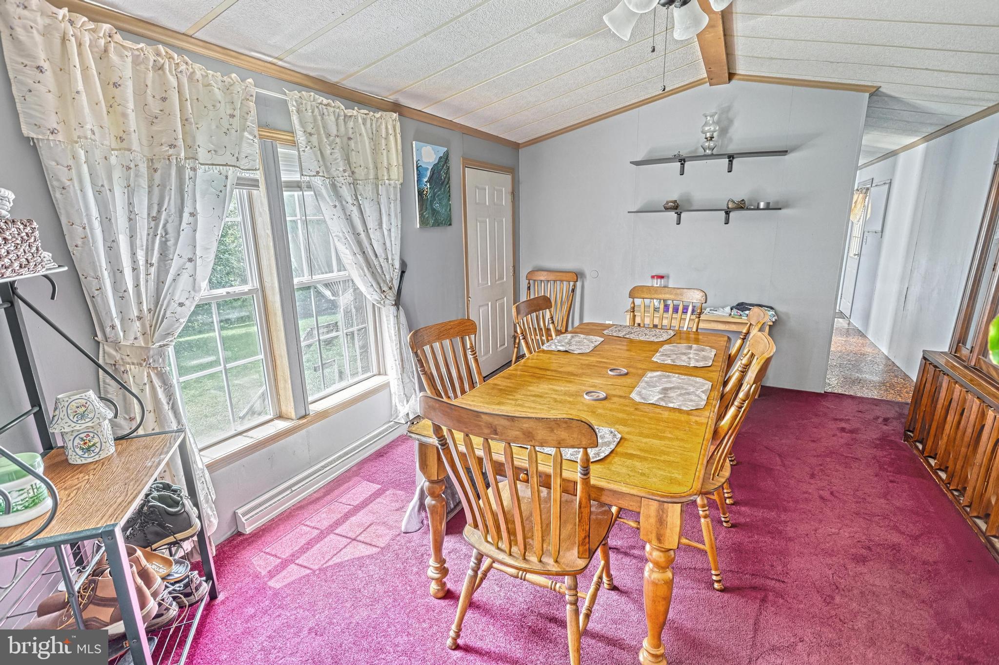 13859 Ebaugh Road Stewartstown, PA 17363 - Photo 15 of 61 a view of a dining room with furniture window and wooden floor