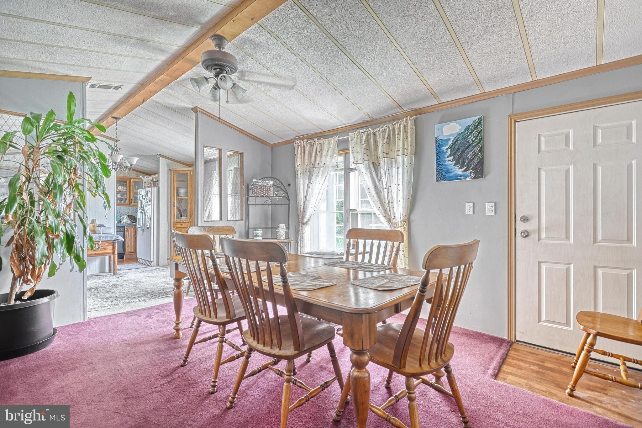 13859 Ebaugh Road Stewartstown, PA 17363 - Photo 16 of 61 a view of a dining room with furniture window and wooden floor
