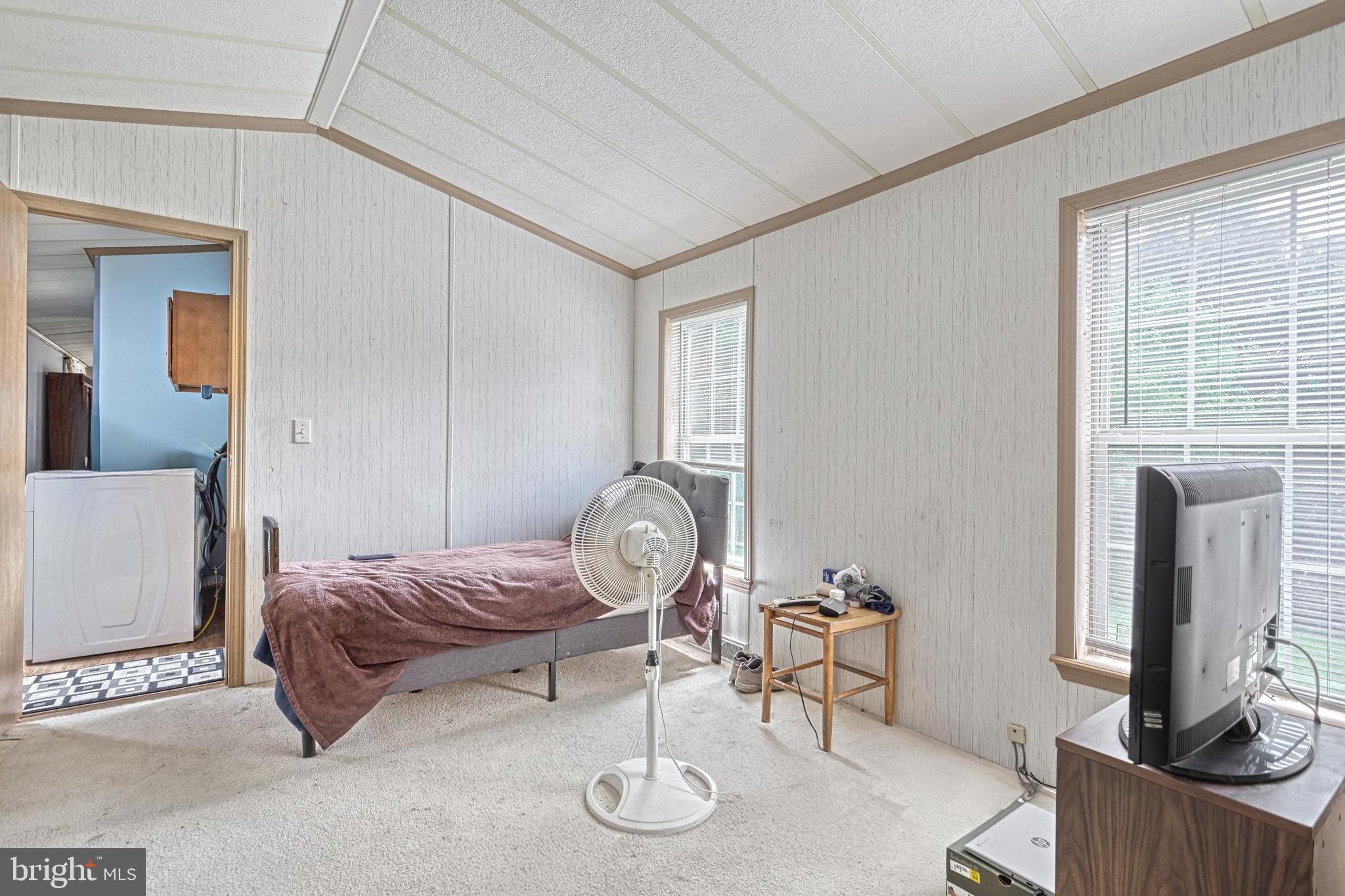 13859 Ebaugh Road Stewartstown, PA 17363 - Photo 21 of 61 a living room with furniture a window and a fireplace
