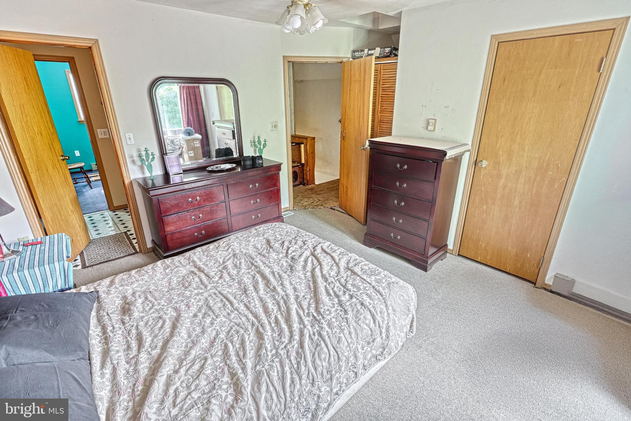 13859 Ebaugh Road Stewartstown, PA 17363 - Photo 25 of 61 a bedroom with a bed and a dresser in it