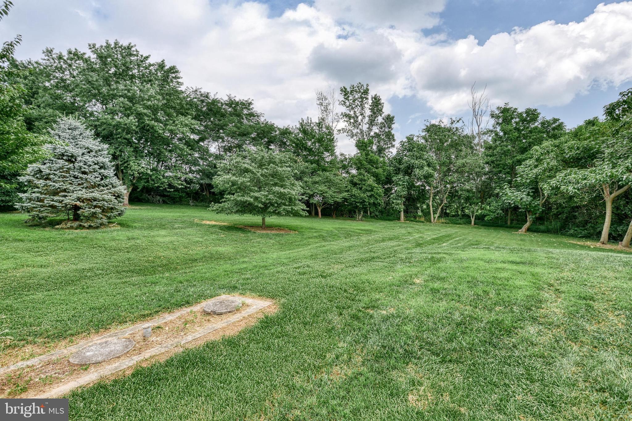 13859 Ebaugh Road Stewartstown, PA 17363 - Photo 30 of 61 a view of a green field with wooden fence