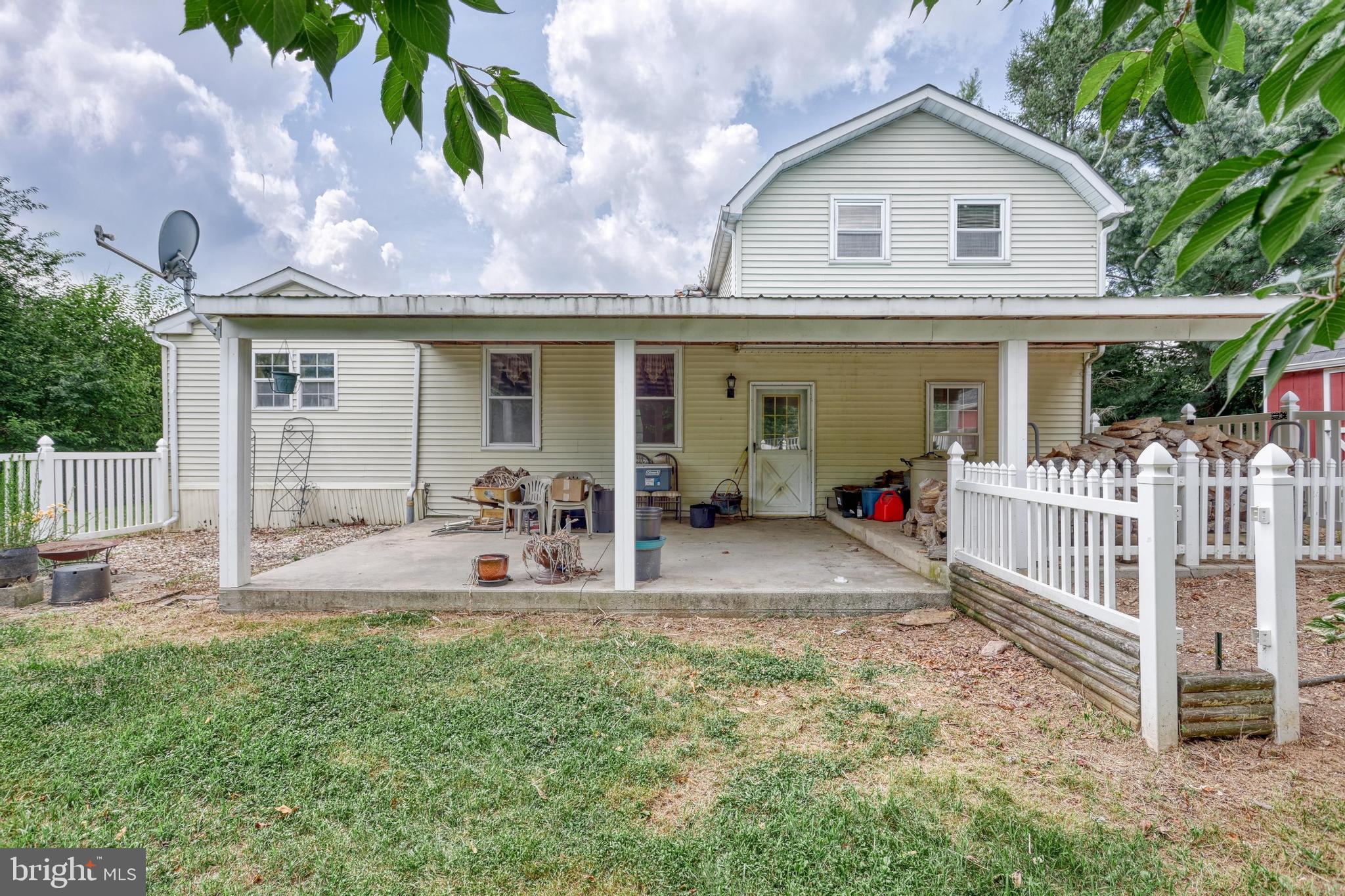 13859 Ebaugh Road Stewartstown, PA 17363 - Photo 33 of 61 a front view of a house with garden