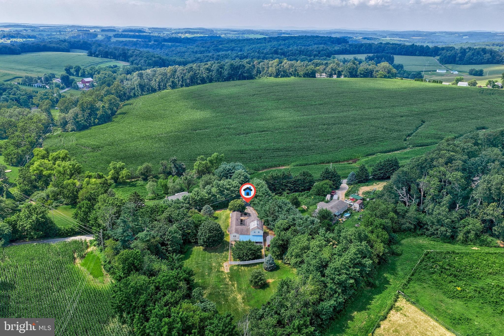 13859 Ebaugh Road Stewartstown, PA 17363 - Photo 44 of 61 a backyard of a house with lots of green space and mountain view