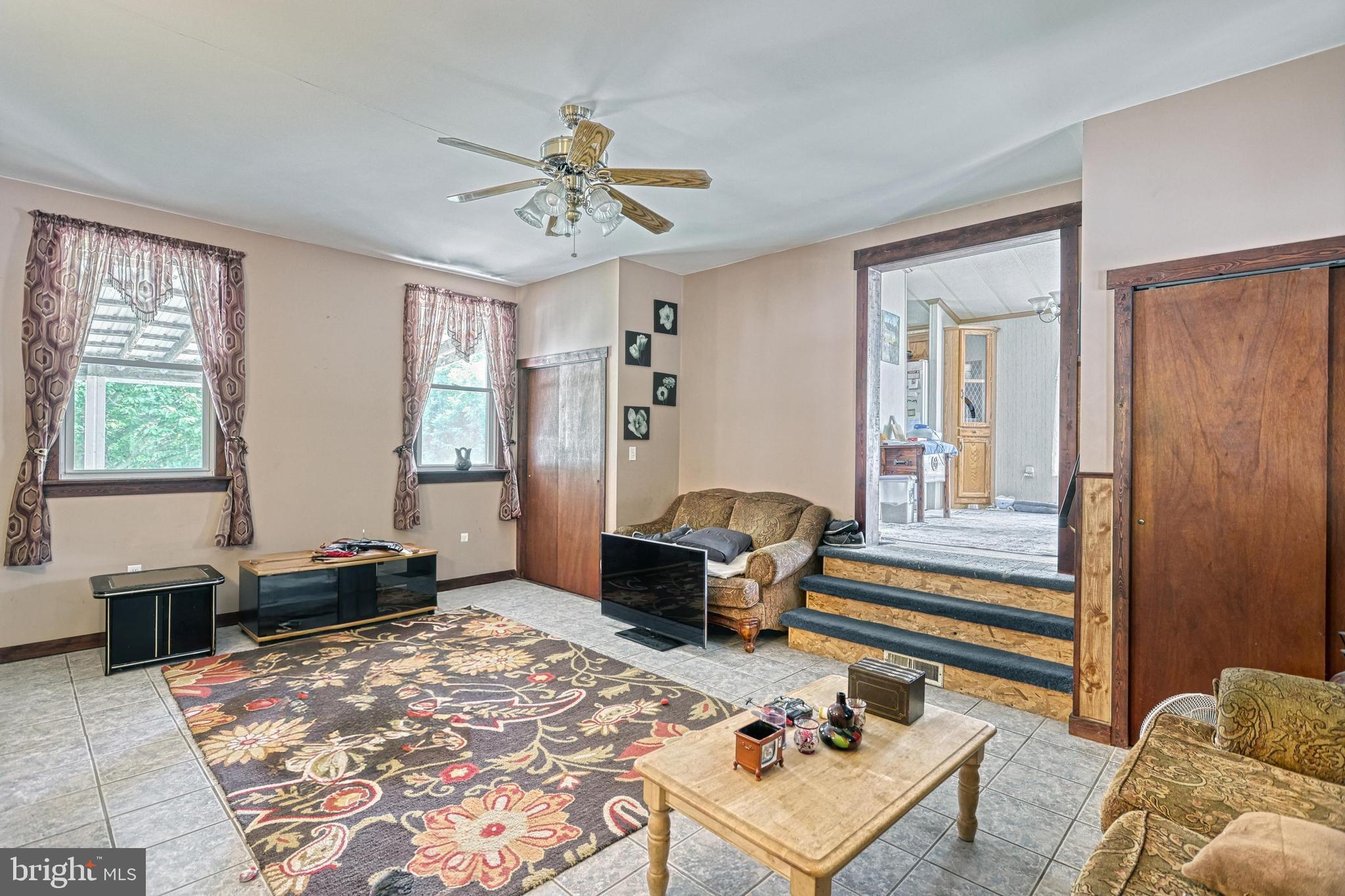 13859 Ebaugh Road Stewartstown, PA 17363 - Photo 6 of 61 a living room with furniture and a window