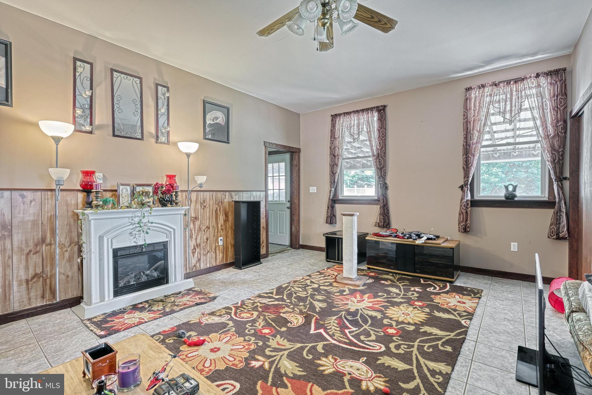 13859 Ebaugh Road Stewartstown, PA 17363 - Photo 7 of 61 a living room with furniture and a fireplace