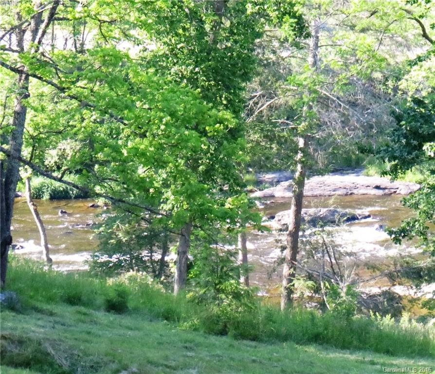 Lot 20 Haystack Road, Unit 20 Waynesville, NC 28785 - Photo 1 of 23 a backyard of a house with lots of green space