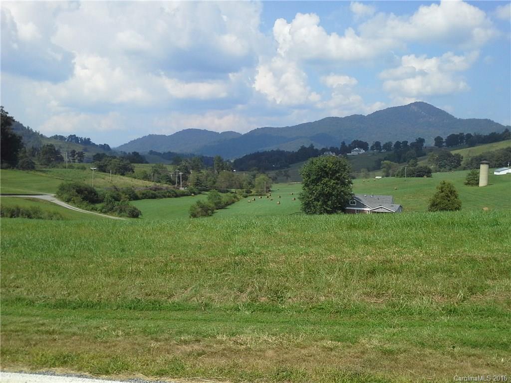 Lot 20 Haystack Road, Unit 20 Waynesville, NC 28785 - Photo 10 of 23 a view of a lake with a mountain in the background