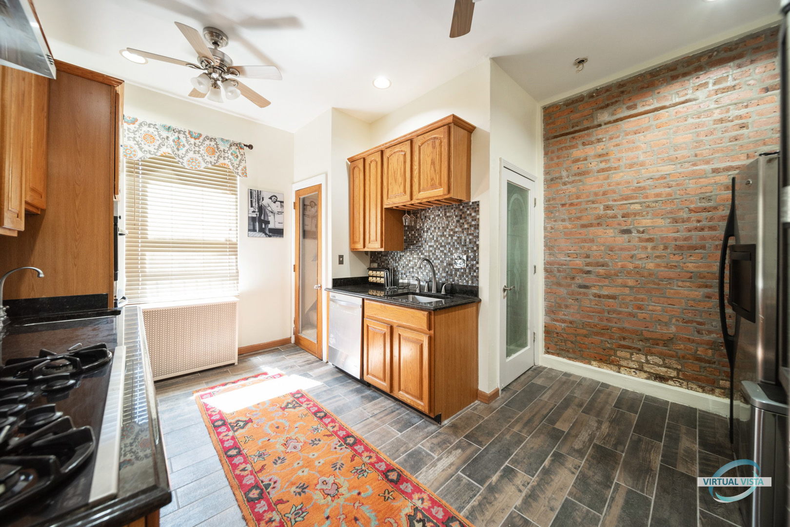 1529 East Marquette Road Chicago, IL 60637 - Photo 9 of 37 a kitchen with stainless steel appliances granite countertop a refrigerator and a stove
