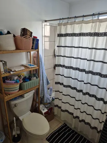 a kitchen with a sink cabinets and window