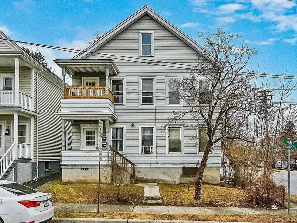 a front view of a house with a garage