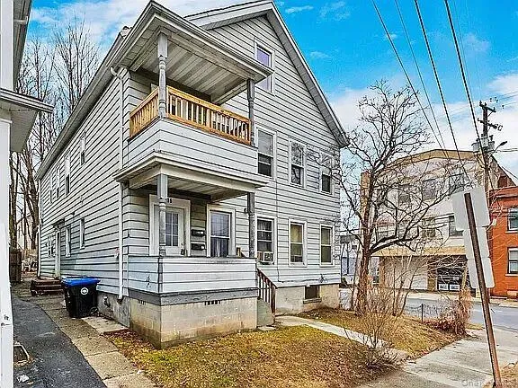 a front view of a house with a balcony