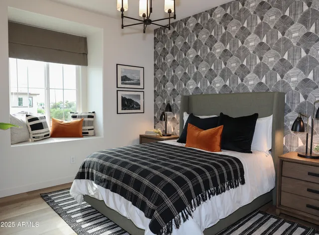 a bathroom with a toilet a sink and wooden floor