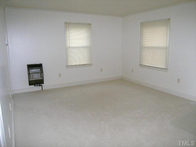 2705 Newbold Street Raleigh, NC 27603 - Photo 8 of 18 an empty room with a window