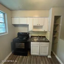 a kitchen with a stove and a refrigerator