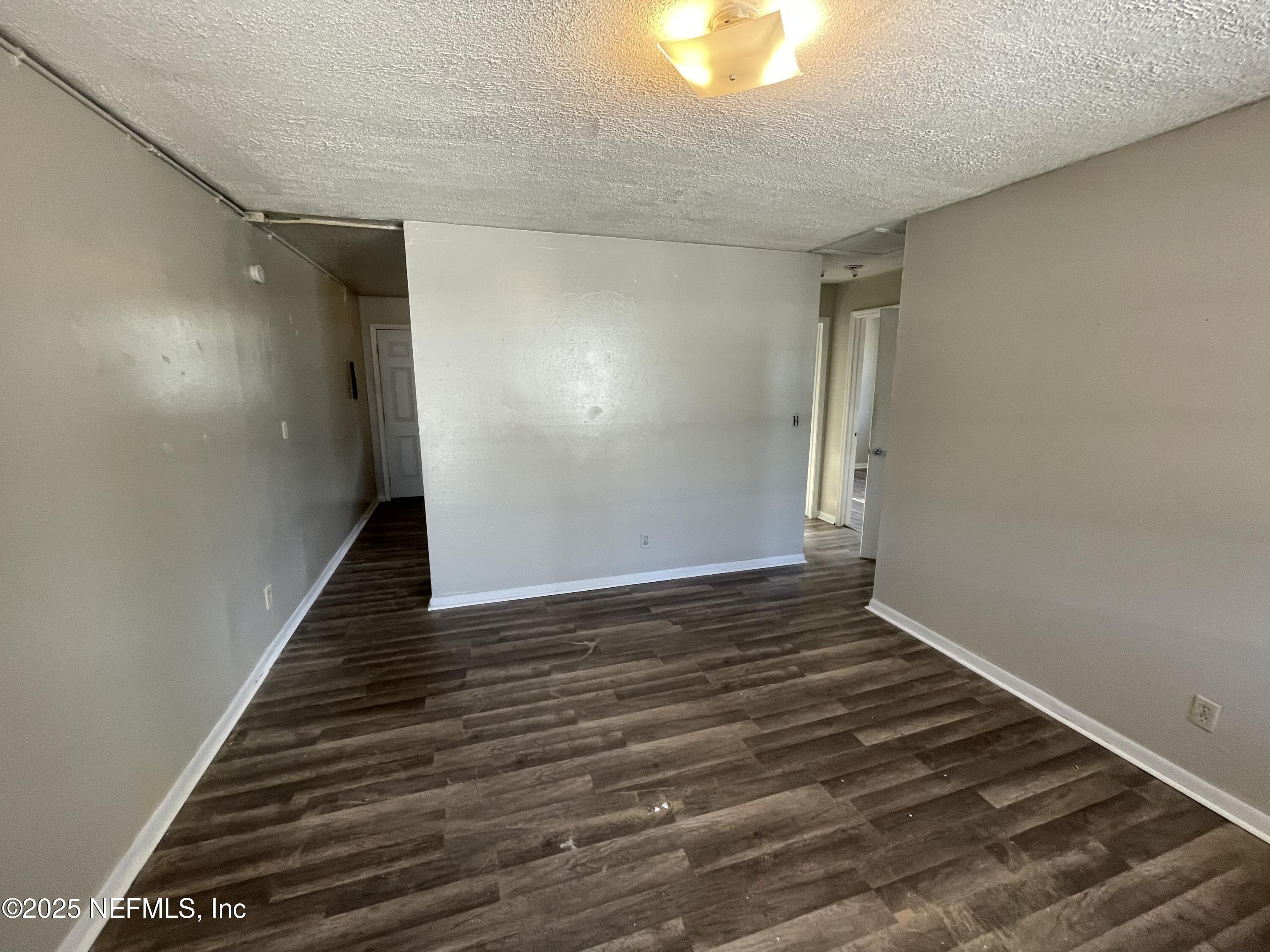 1624 West 36th Street, Unit 3 Jacksonville, FL 32209 - Photo 4 of 7 a view of an empty room with wooden floor
