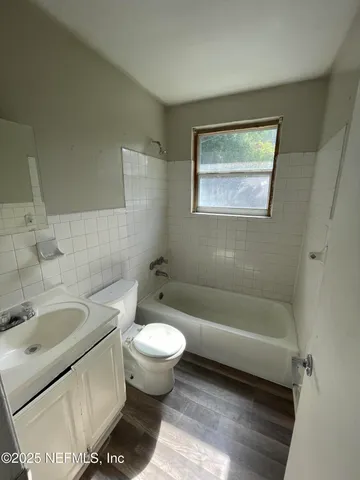 a bathroom with a sink toilet and bathtub