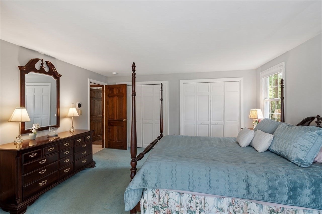 17 Enfield Drive Andover, MA 01810 - Photo 13 of 37 a bedroom with a bed a mirror on dresser and a window