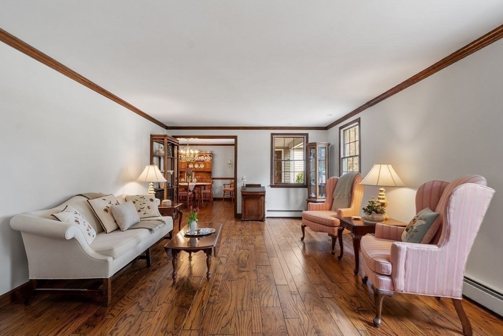 17 Enfield Drive Andover, MA 01810 - Photo 15 of 37 a living room with furniture and wooden floor