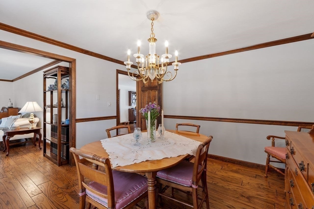 17 Enfield Drive Andover, MA 01810 - Photo 16 of 37 a view of a dining room with furniture and wooden floor