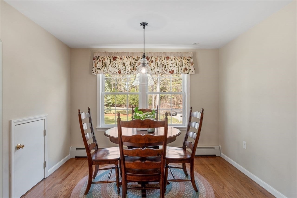 17 Enfield Drive Andover, MA 01810 - Photo 23 of 37 a view of a dining room with furniture window and wooden floor