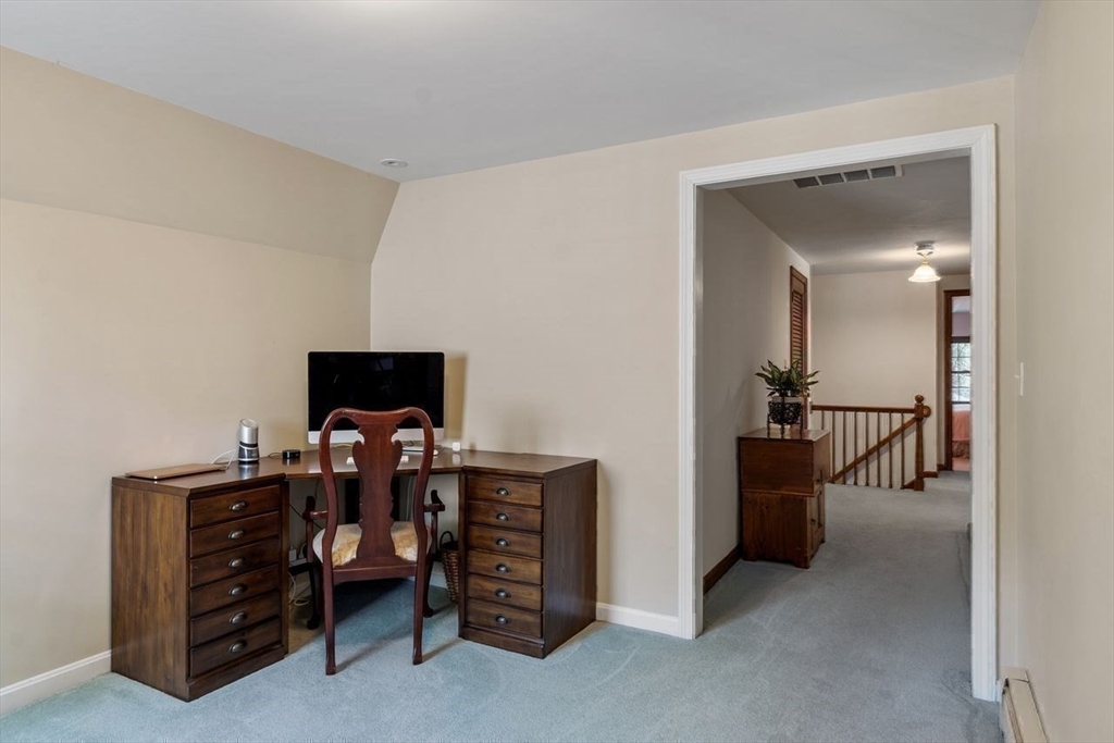 17 Enfield Drive Andover, MA 01810 - Photo 26 of 37 a living room with furniture and a flat screen tv