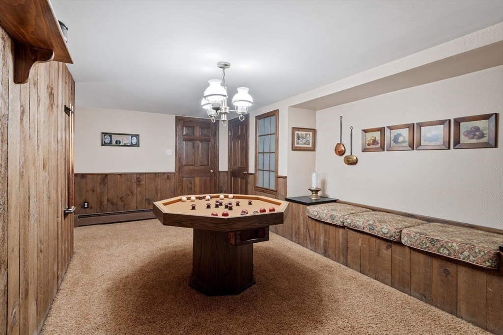 17 Enfield Drive Andover, MA 01810 - Photo 30 of 37 a bathroom with a sink a mirror and a bathtub