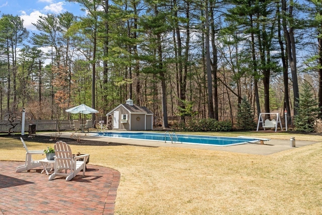 17 Enfield Drive Andover, MA 01810 - Photo 31 of 37 a front view of a house with swimming pool and patio