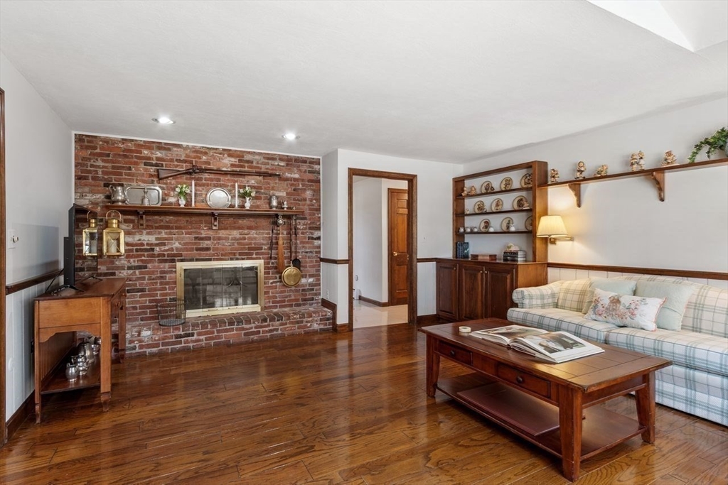 17 Enfield Drive Andover, MA 01810 - Photo 9 of 37 a living room with furniture and a fireplace