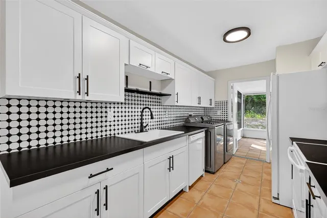 a kitchen with a sink and cabinets