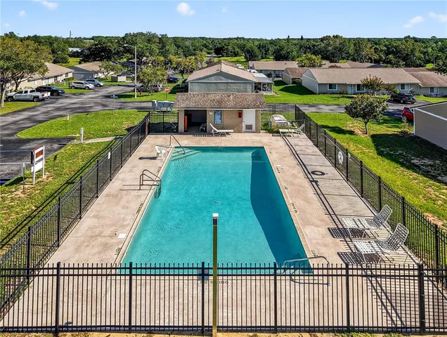 a view of a swimming pool with a lounge chairs