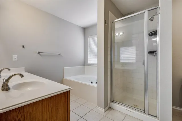 a bathroom with a sink and a shower