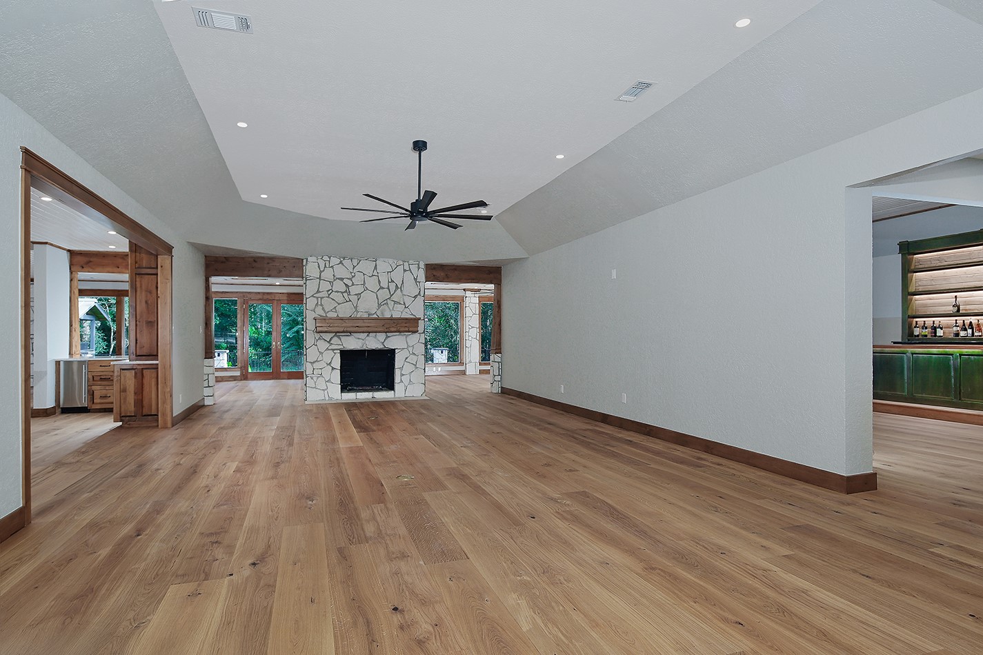26442 McDonald Road Spring, TX 77380 - Photo 50 of 50 Original Photo: Living room is exceptional in size, openness and statement stone fireplace anchors the room perfectly. Excellent well-designed floor plan layout.