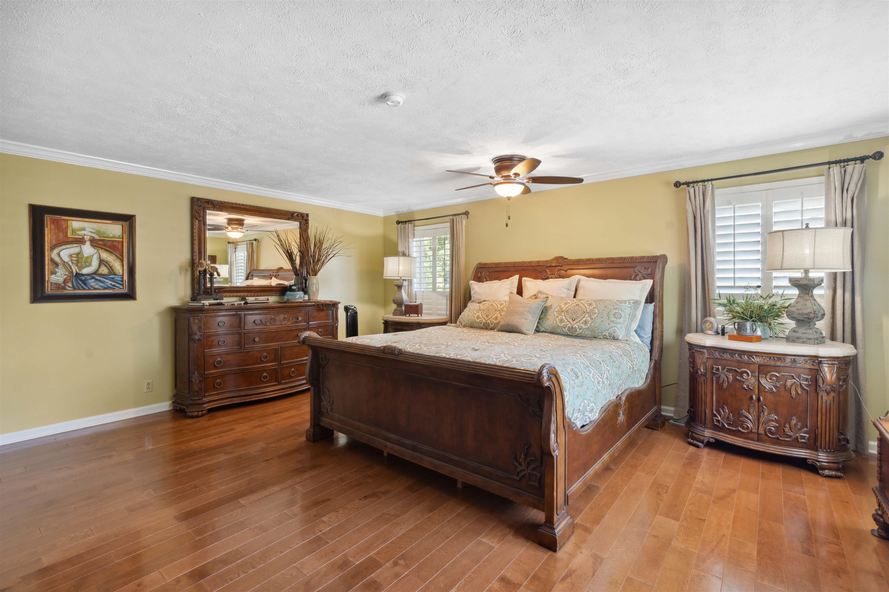 155 Carlins Road Hornsby, TN 38044 - Photo 17 of 40 Bedroom featuring multiple windows, hardwood / wood-style flooring, and ceiling fan