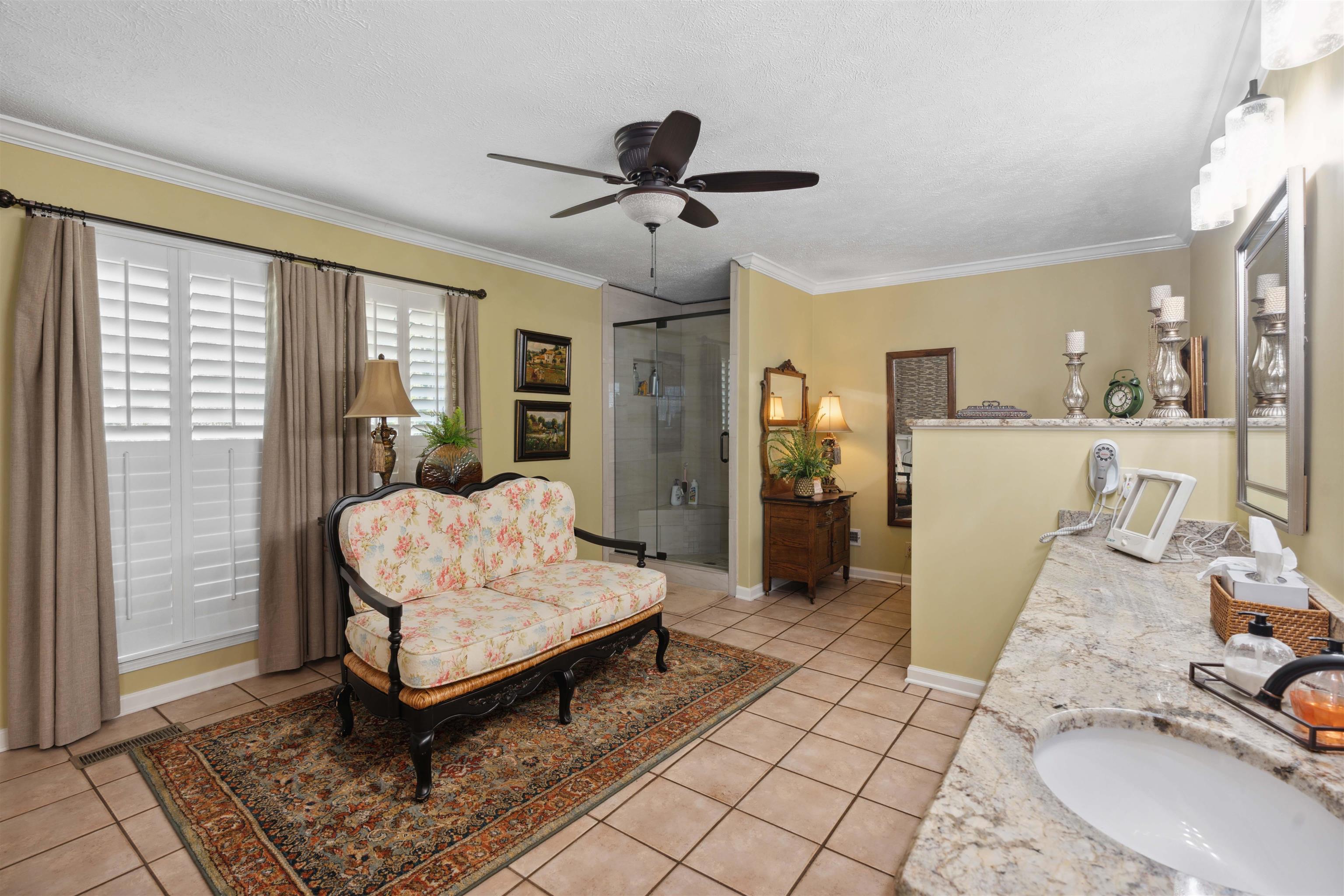 155 Carlins Road Hornsby, TN 38044 - Photo 23 of 40 Interior space with ceiling fan, crown molding, sink, a textured ceiling, and light tile patterned floors