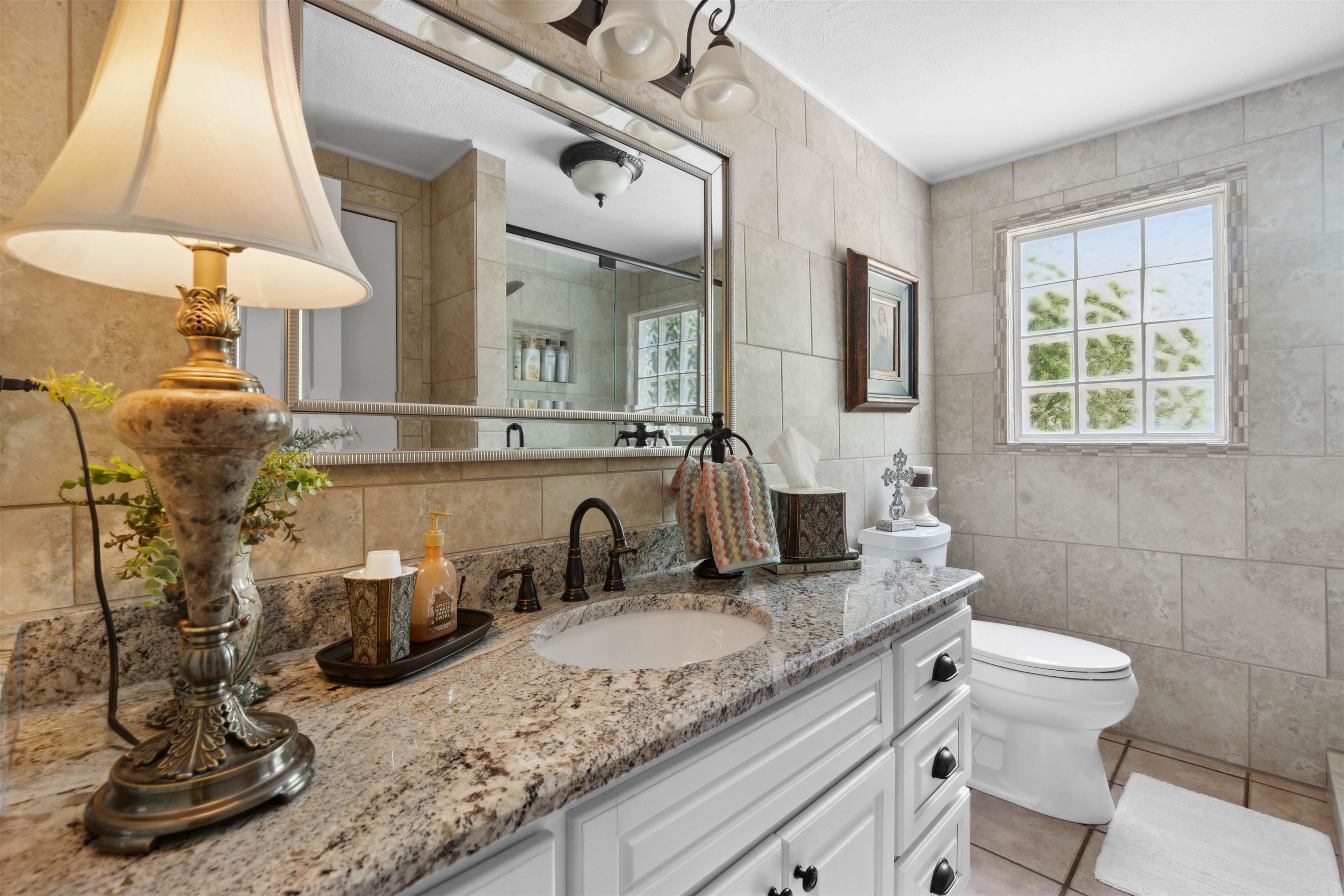 155 Carlins Road Hornsby, TN 38044 - Photo 24 of 40 Bathroom featuring tile patterned flooring, tile walls, toilet, and vanity