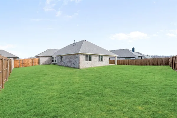 a black and white photo of a bench